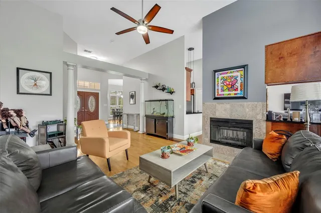 a living room with furniture and a fireplace