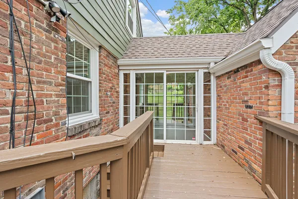 a balcony with furniture and window