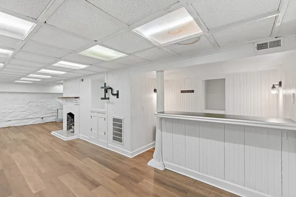 a kitchen with a refrigerator and window