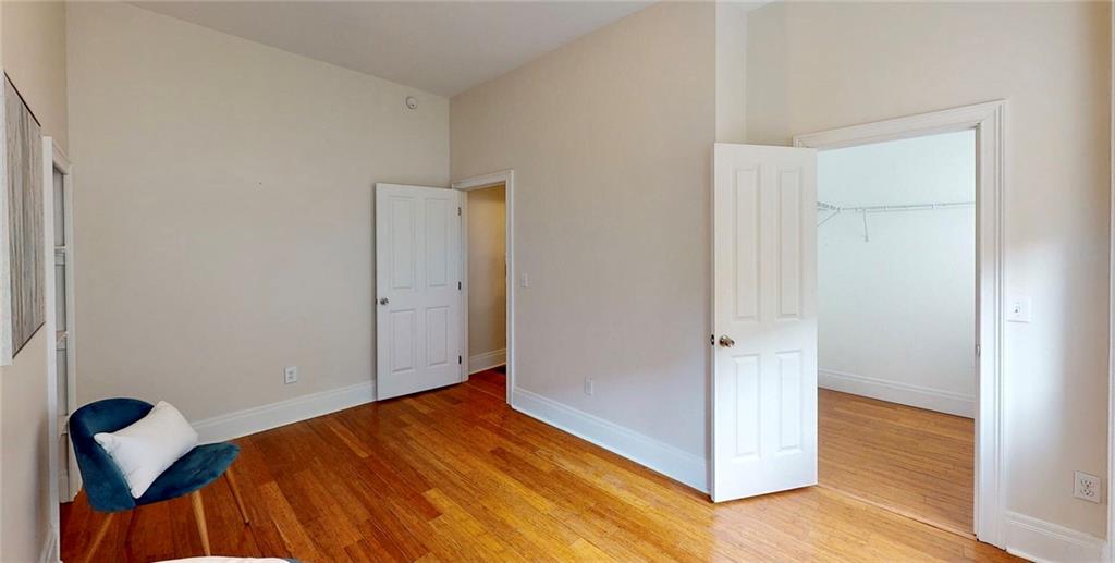 1321 Reddour Street Pittsburgh, PA 15212 - Photo 14 of 21 a view of a room that has a bed and wooden floor