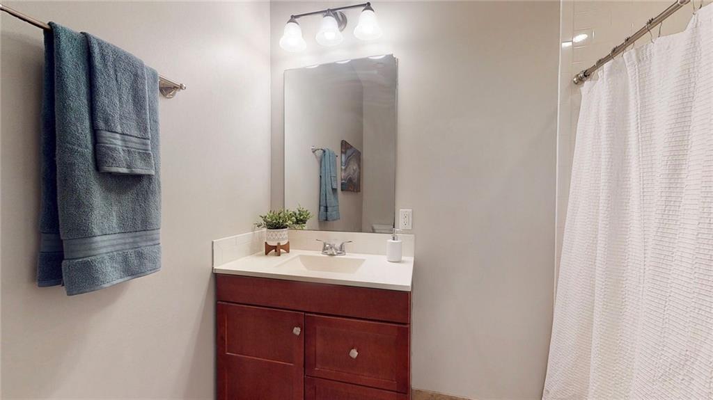 1321 Reddour Street Pittsburgh, PA 15212 - Photo 15 of 21 a bathroom with a sink and a mirror