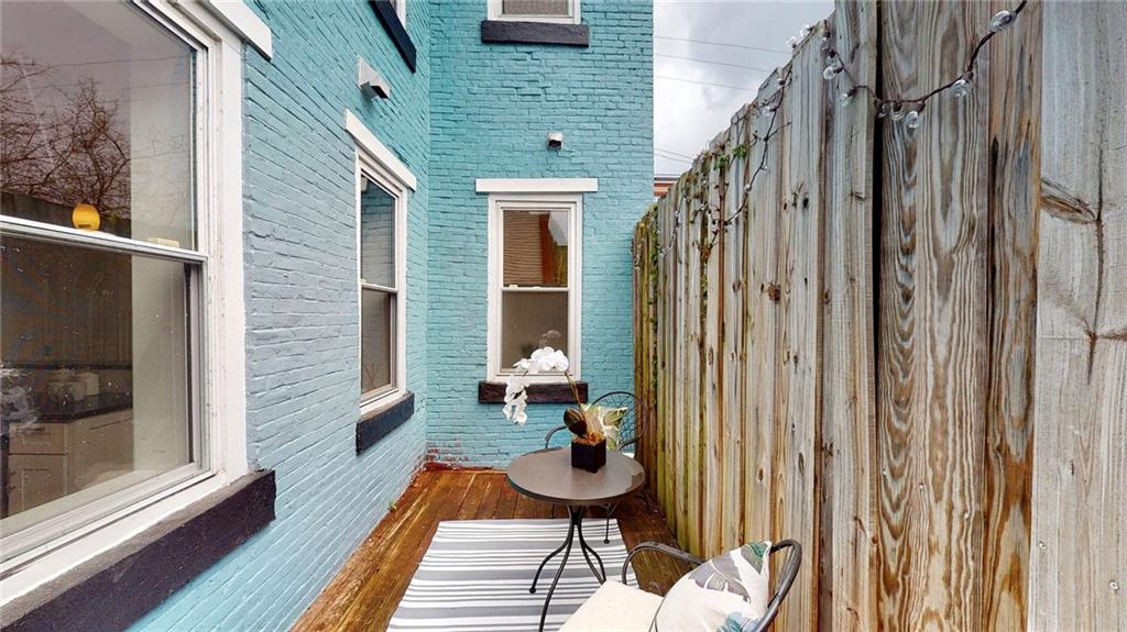 1321 Reddour Street Pittsburgh, PA 15212 - Photo 18 of 21 a balcony with chairs and wooden floor