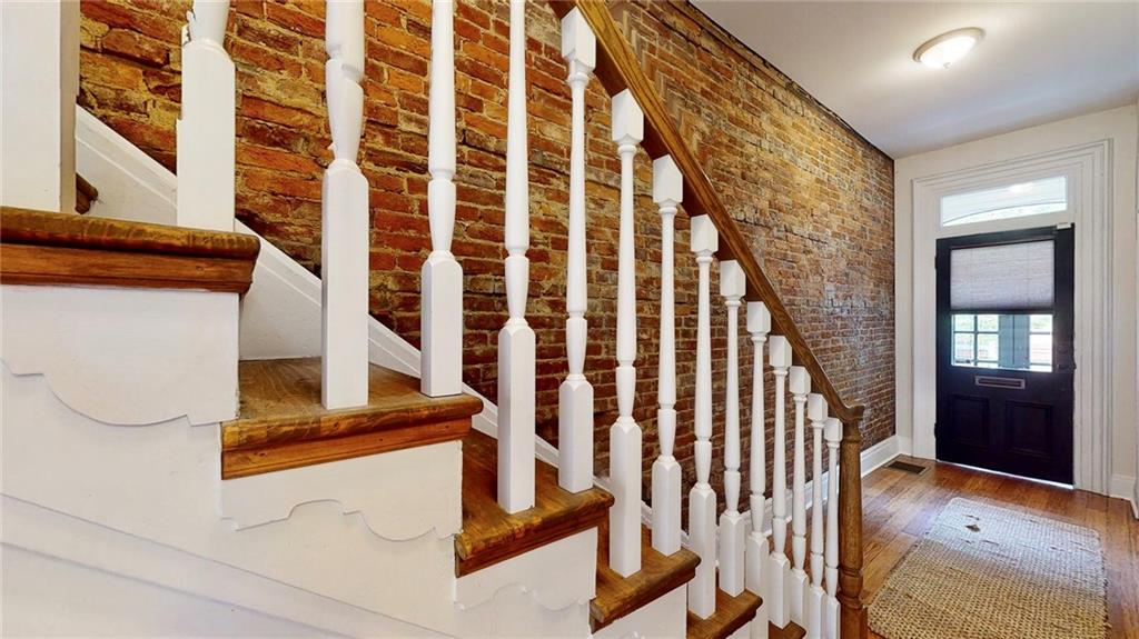 1321 Reddour Street Pittsburgh, PA 15212 - Photo 2 of 21 a view of staircase with railing and a rug
