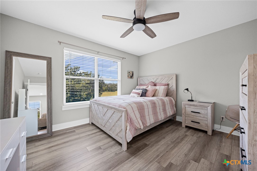 28099 Fm 2670 Killeen, TX 76549 - Photo 25 of 48 a bedroom with a bed and a large window