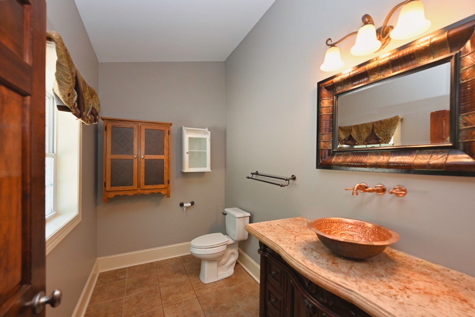 125 Happy Hollow Road Goodlettsville, TN 37072 - Photo 57 of 92 a bathroom with a granite countertop sink a toilet and mirror