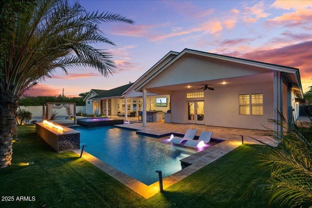 a large kitchen with a large counter top appliances and furniture