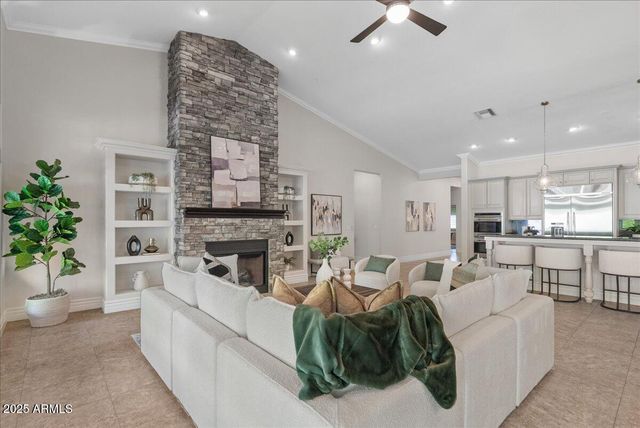a kitchen with granite countertop stainless steel appliances a sink and cabinets