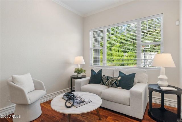 a large white kitchen with stainless steel appliances kitchen island granite countertop a sink and cabinets