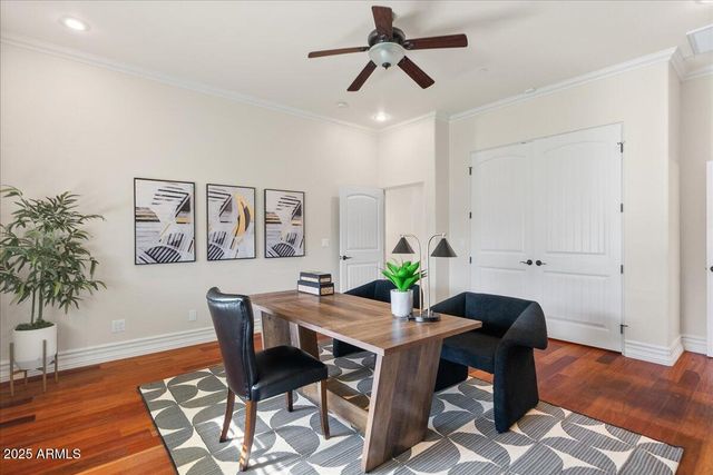 a view of a porch with furniture and garden