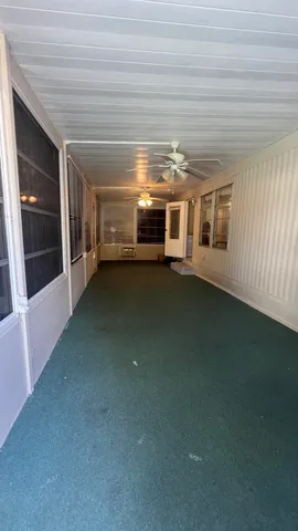 a view of a livingroom with an empty space and window