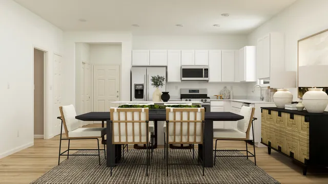 a kitchen with a dining table chairs and a refrigerator