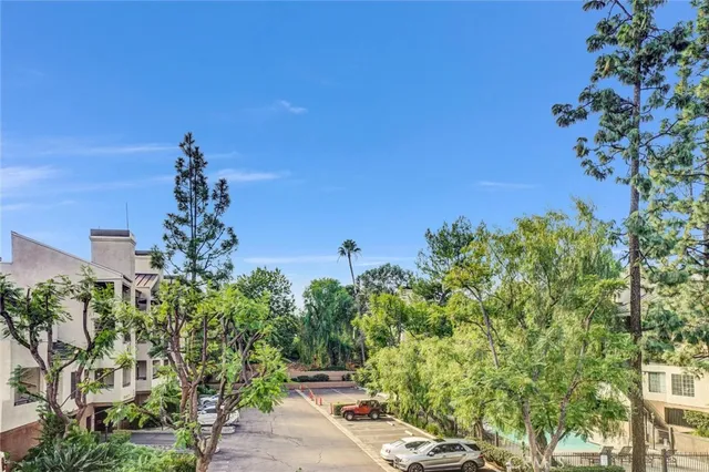 a kitchen with a sink dishwasher a stove and a refrigerator with wooden floor