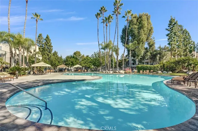 a front view of a house with outdoor seating