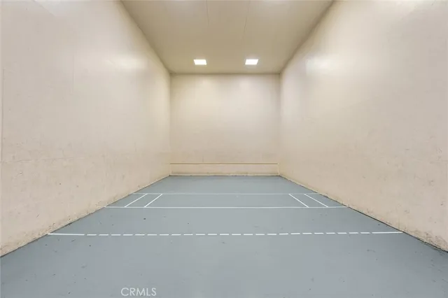 a view of a swimming pool with outdoor seating