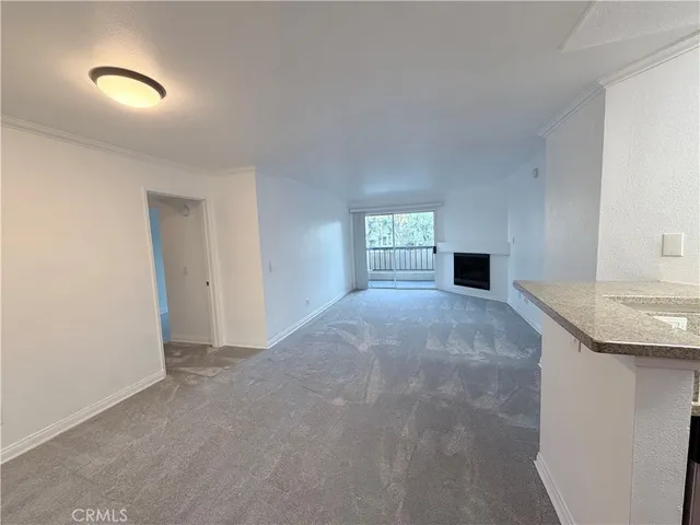 a view of empty room with a window