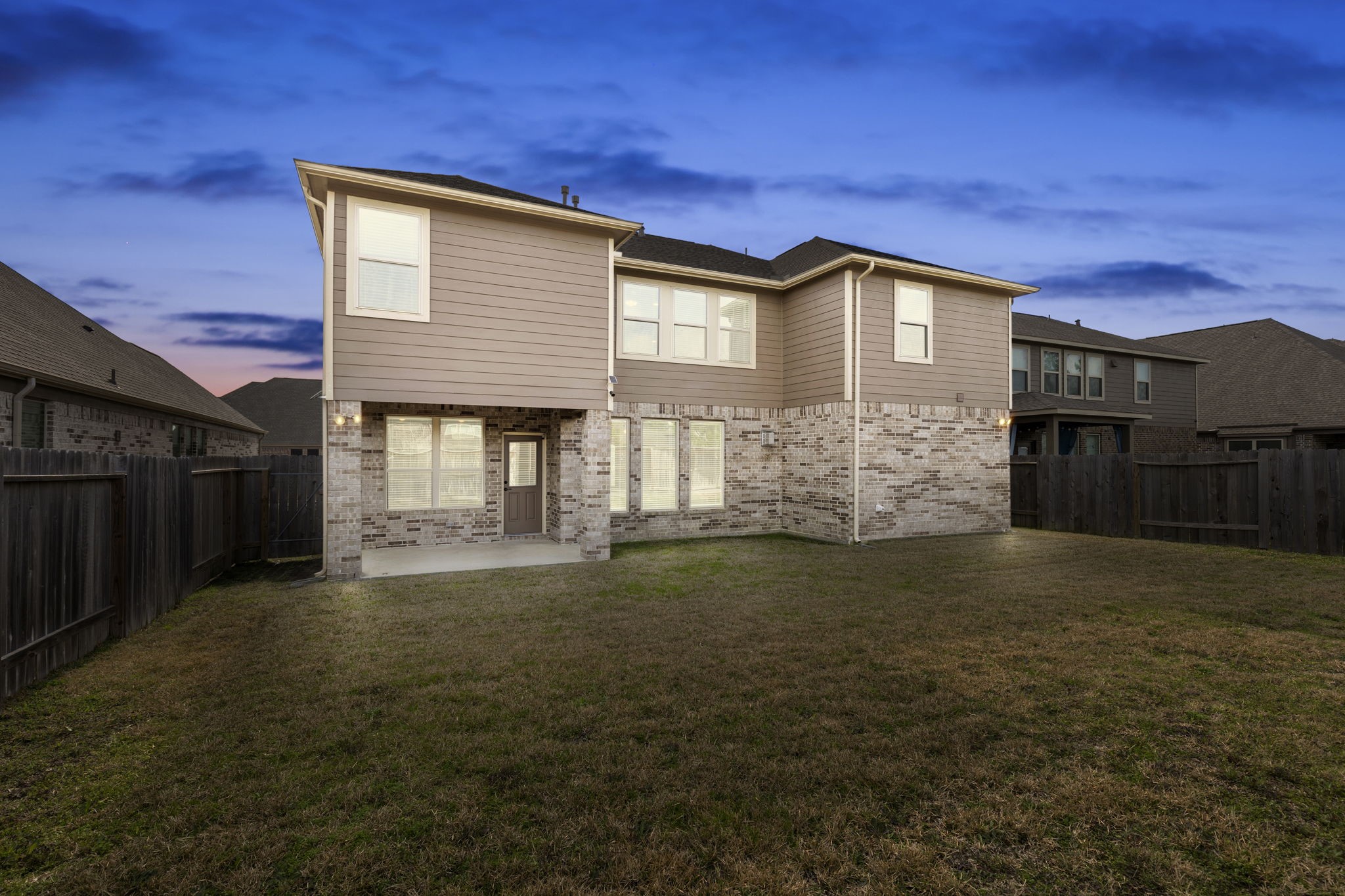 2819 Bradbury Hills Road Spring, TX 77373 - Photo 46 of 50 Experience serene twilight views from this spacious backyard, perfect for relaxation and entertaining.