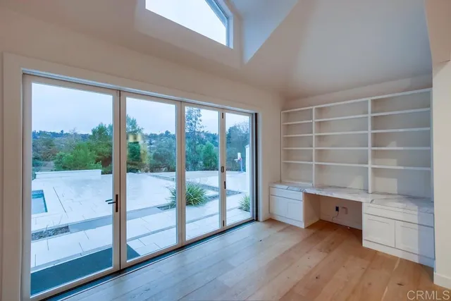 a bathroom with a shower sink mirror and toilet