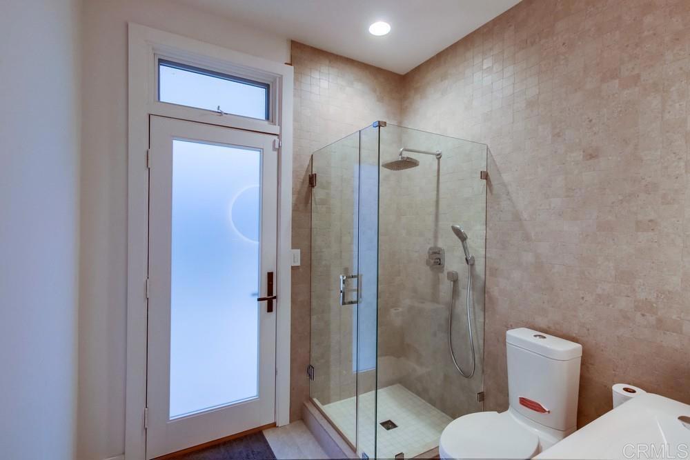 4124 Stonebridge Lane Rancho Santa Fe, CA 92091 - Photo 12 of 31 a bathroom with a shower sink mirror and toilet