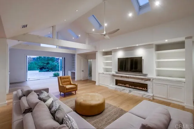 a kitchen with stainless steel appliances granite countertop a sink dishwasher a stove and a microwave oven with cabinets