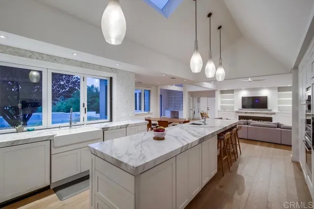 a kitchen with a sink stove and cabinets