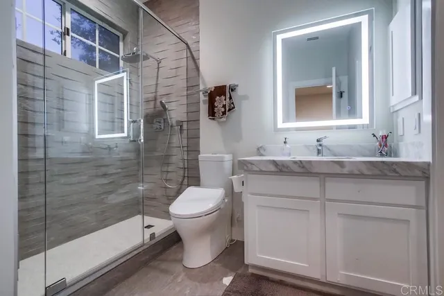 a view of a big yard with plants and large trees