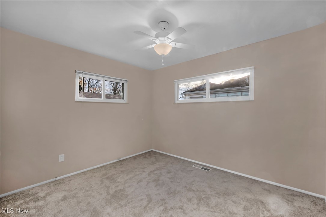 267 Barrett Road Berea, OH 44017 - Photo 32 of 41 Unfurnished room with ceiling fan and light colored carpet