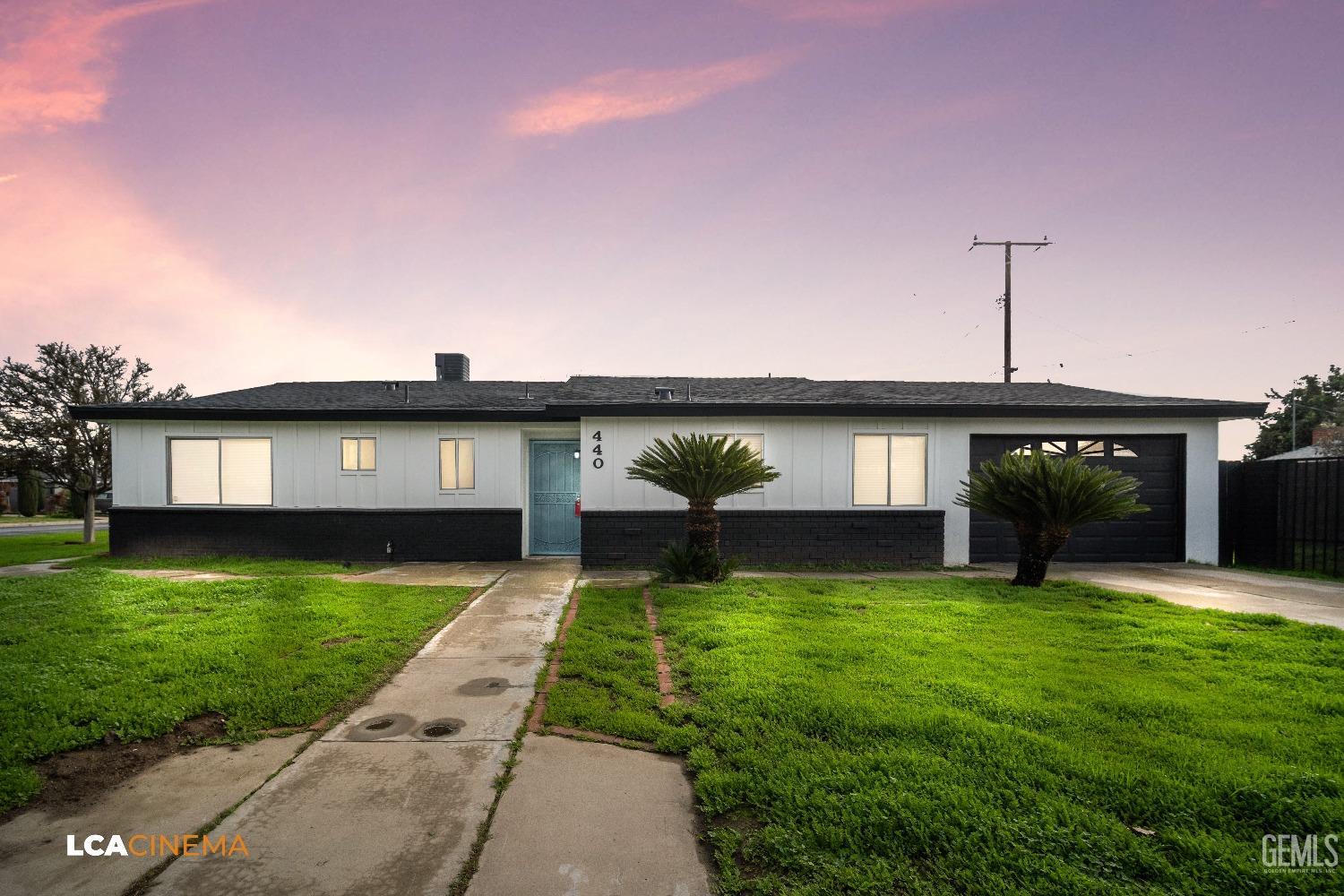a view of a house with a yard porch and a patio