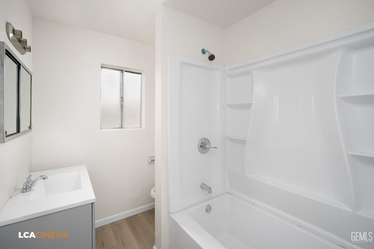 Undisclosed Address Earlimart, CA 93219 - Photo 12 of 18 a white bath tub sitting next to a white sink