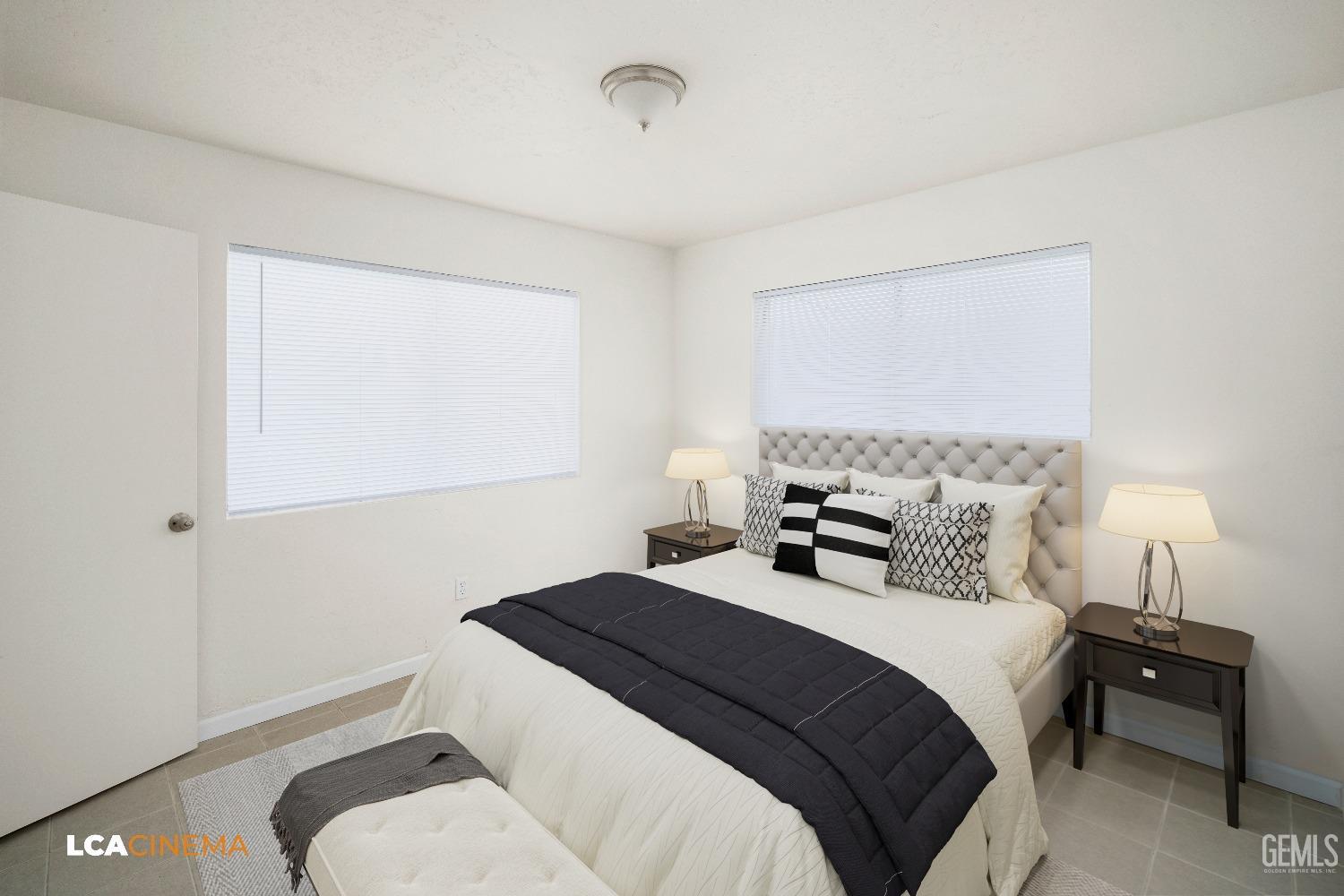 Undisclosed Address Earlimart, CA 93219 - Photo 18 of 18 a bedroom with a bed and a lamp