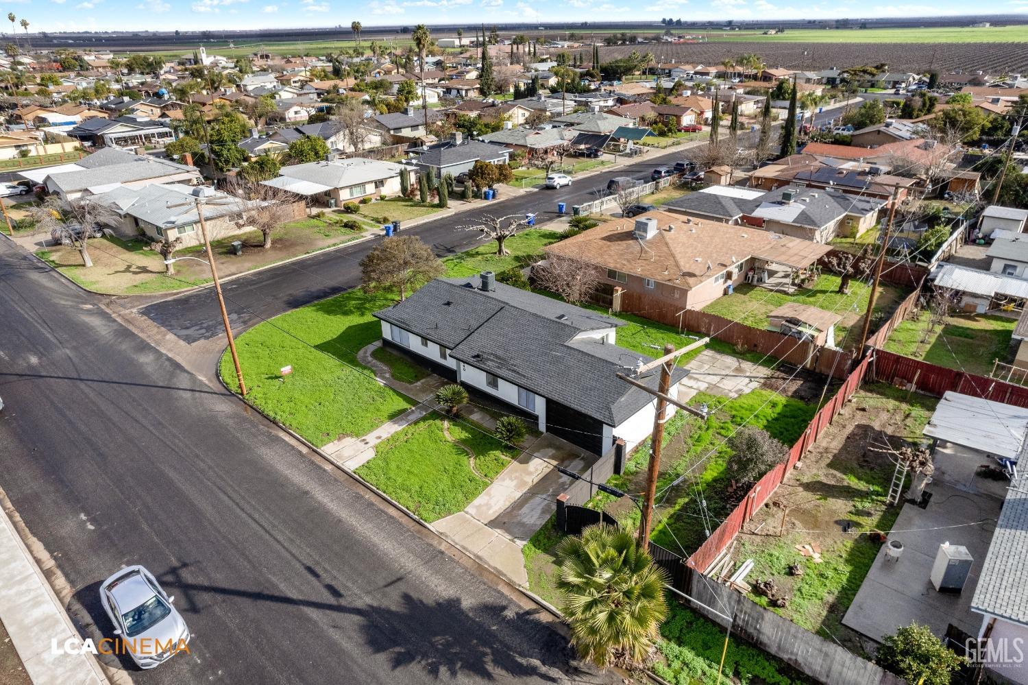 Undisclosed Address Earlimart, CA 93219 - Photo 5 of 18 an aerial view of residential houses with outdoor space
