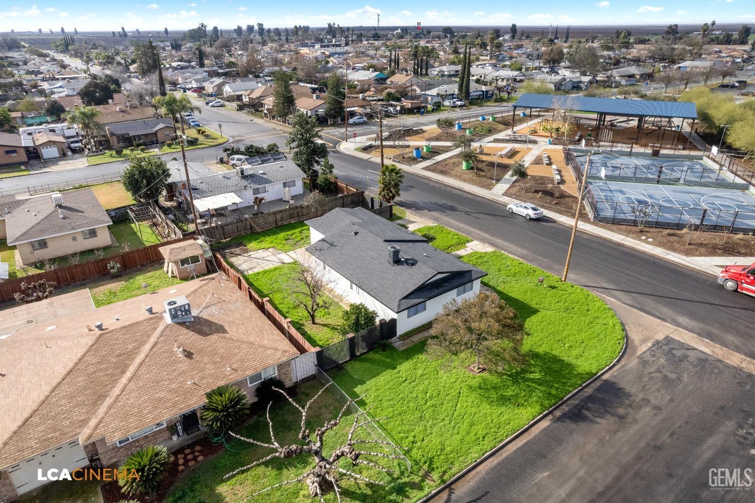 Undisclosed Address Earlimart, CA 93219 - Photo 6 of 18 an aerial view of a house with a garden