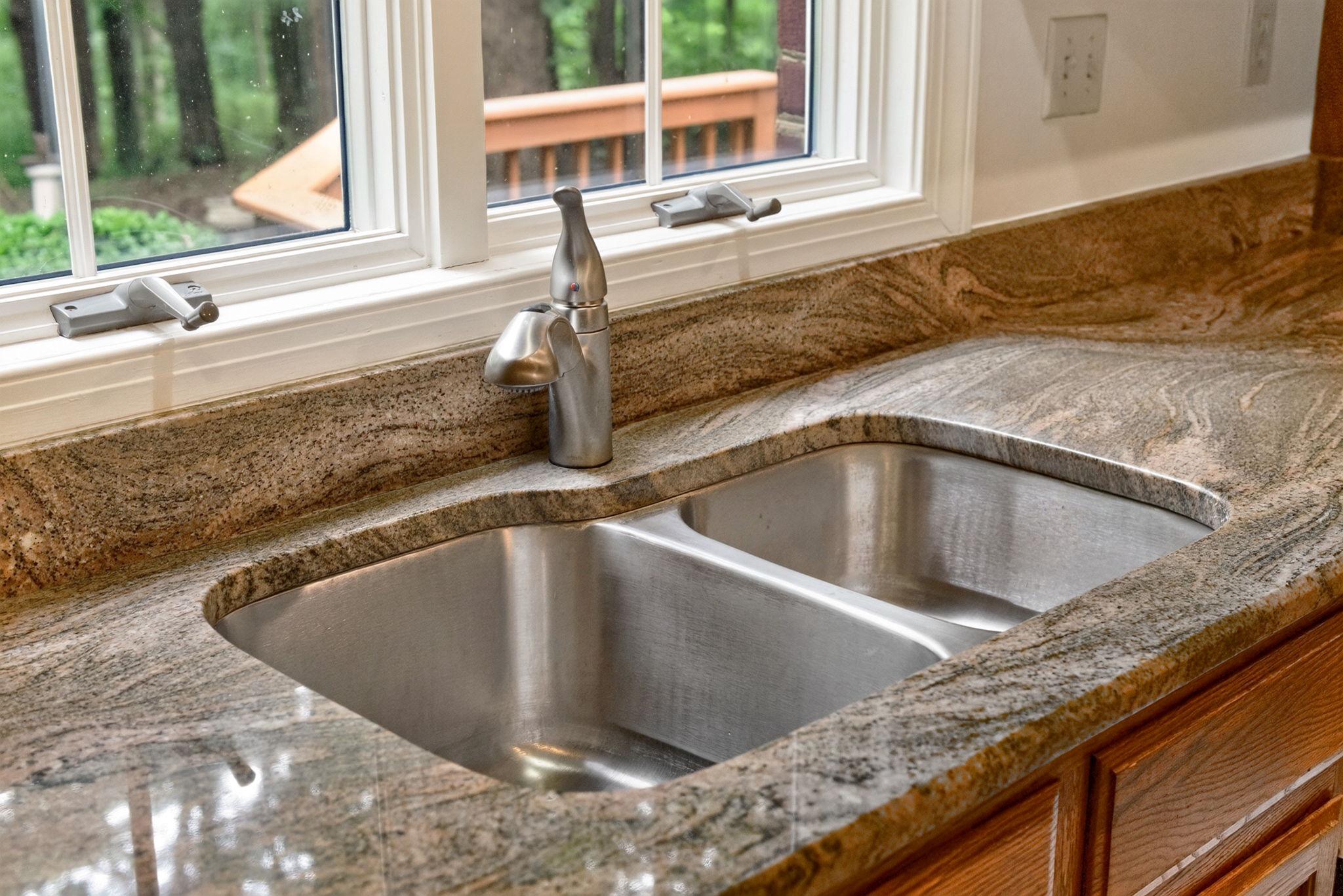 7501 Moormont Road Rapidan, VA 22733 - Photo 17 of 76 Sleek kitchen sink with natural stone.