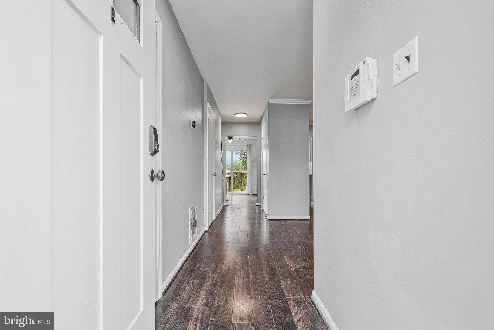 1675 Ridgely Court, Unit 182 Crofton, MD 21114 - Photo 16 of 47 a view of a hallway with wooden floor