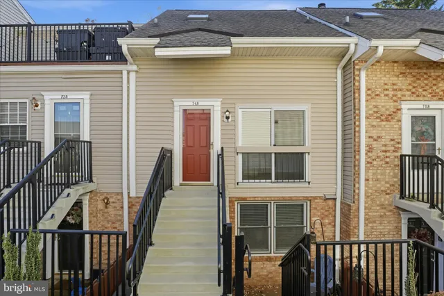 a front view of a house with many windows