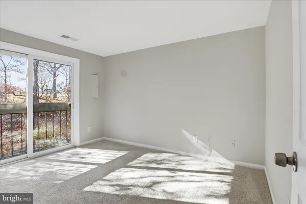 a view of a room with wooden floor and bedroom