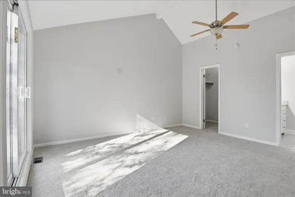 a view of room with a ceiling fan