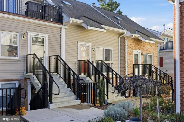 a view of a house with wooden stairs