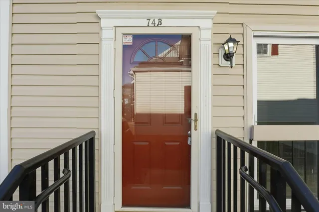a view of a door and a window