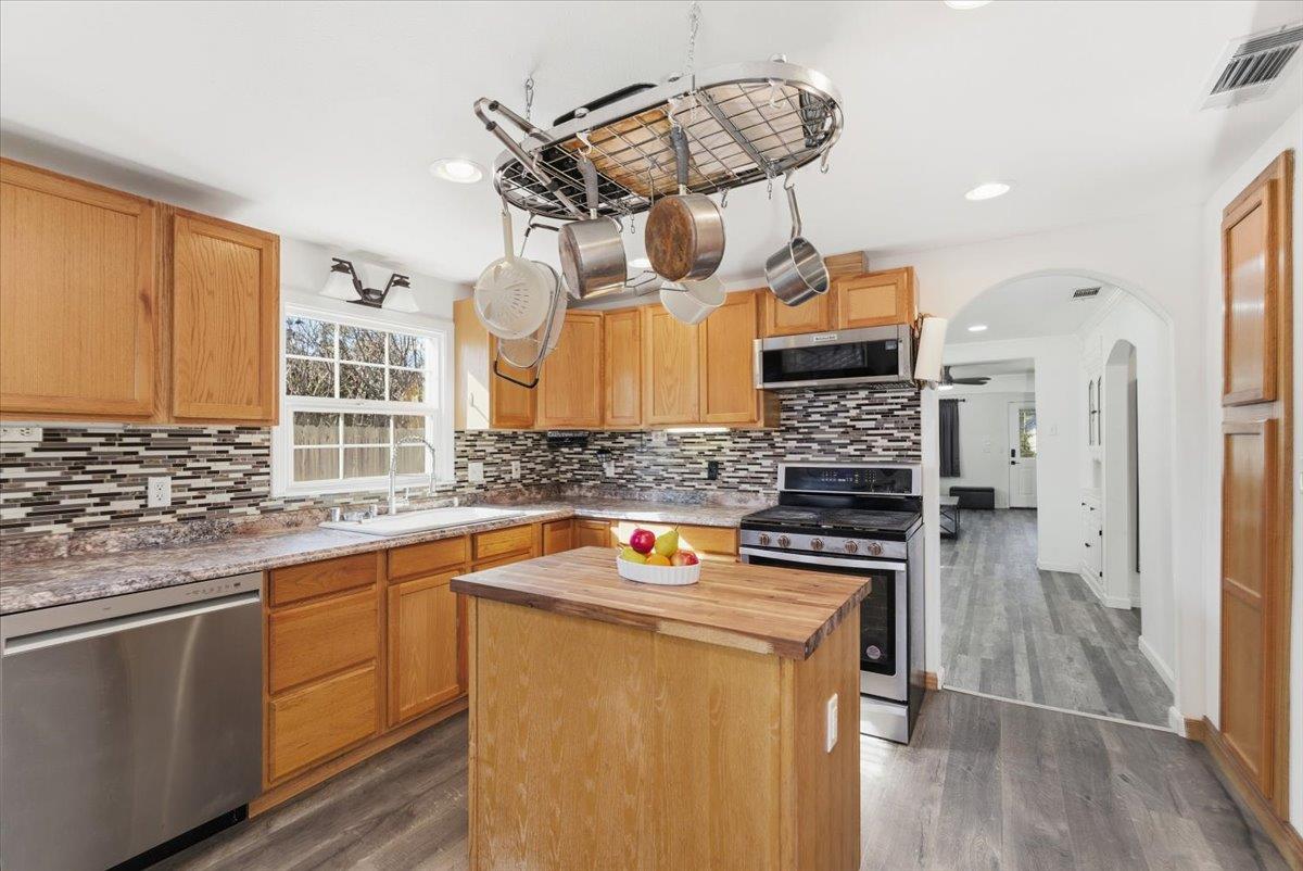 1939 1st Avenue Sutter, CA 95982 - Photo 17 of 35 a kitchen with stainless steel appliances granite countertop a stove and a sink