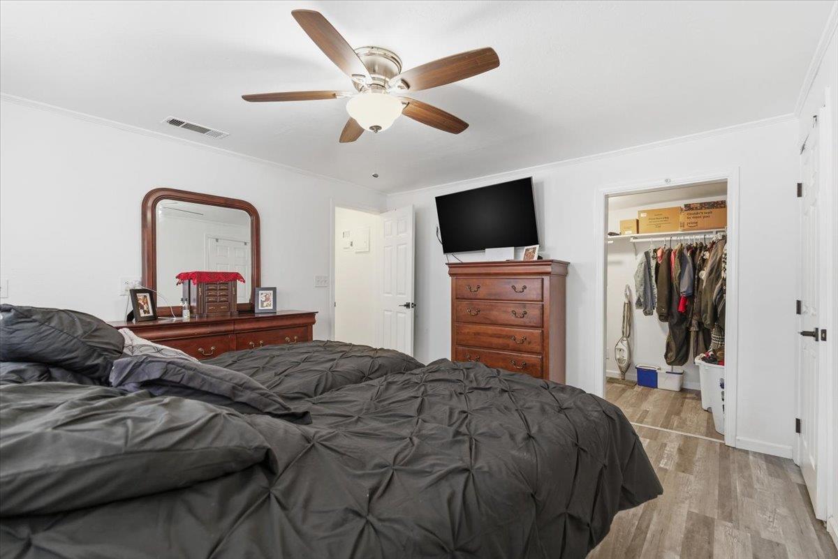 1939 1st Avenue Sutter, CA 95982 - Photo 24 of 35 a bedroom with a bed and a flat screen tv