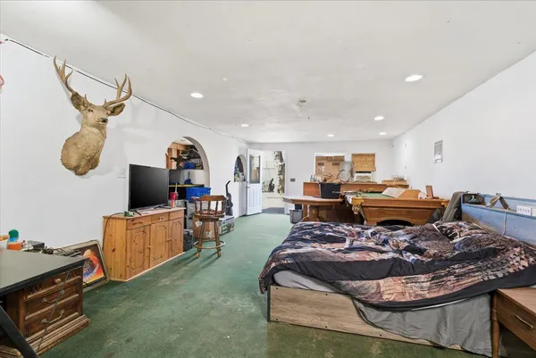 a bed room with furniture and a window