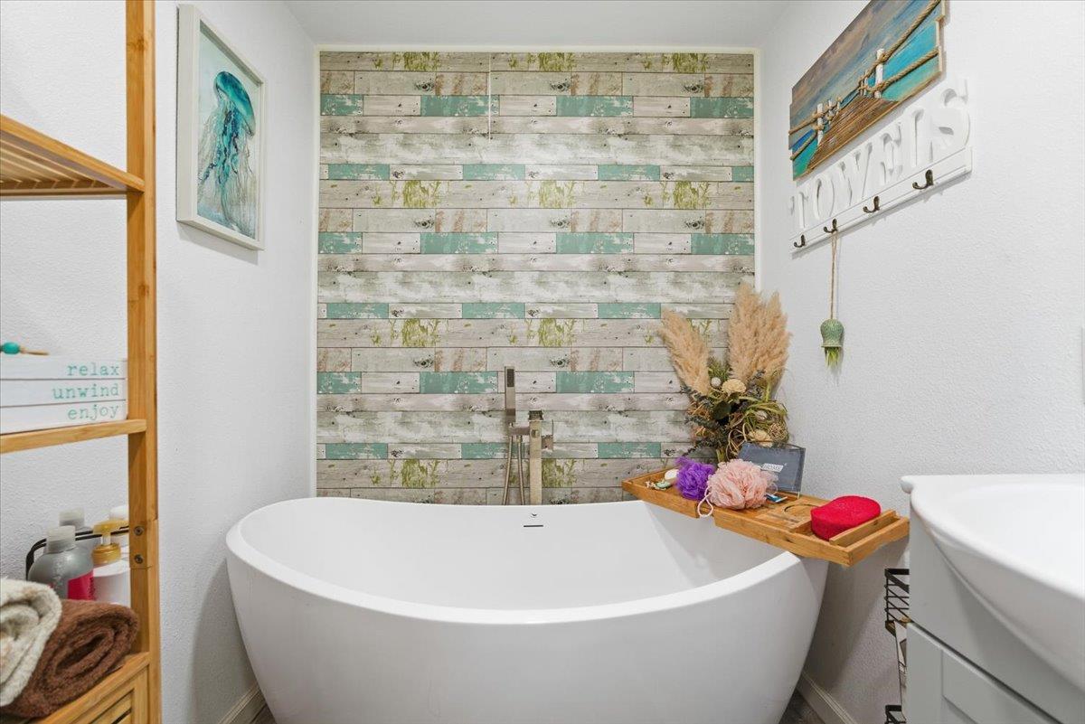 1939 1st Avenue Sutter, CA 95982 - Photo 28 of 35 a bathroom with a sink and a bathtub