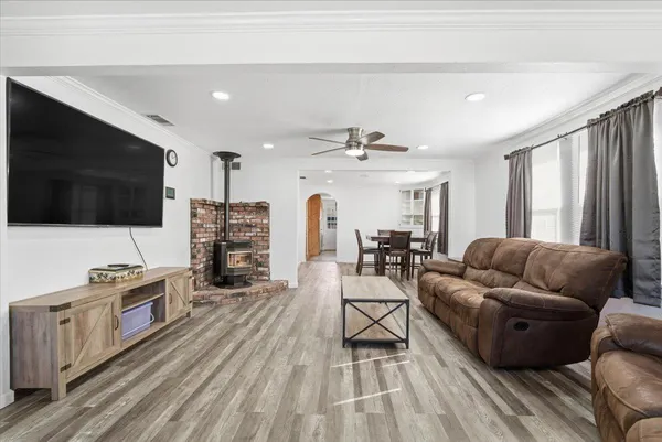 a living room with furniture and a flat screen tv