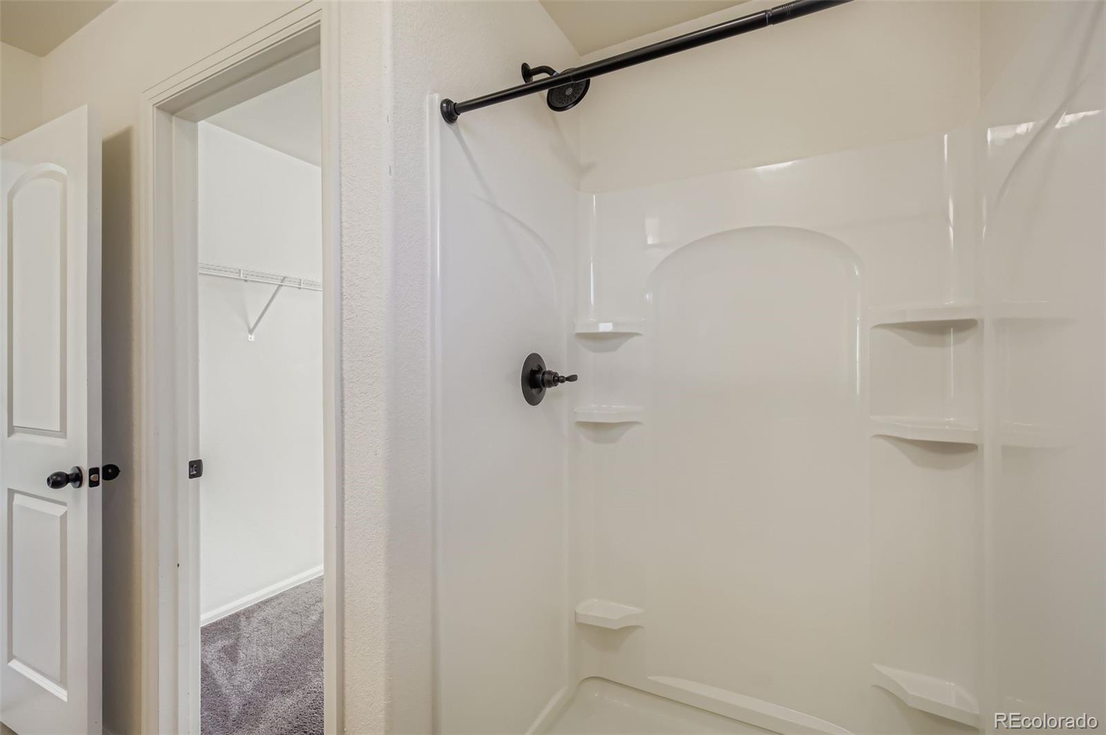 10300 19th St Road Greeley, CO 80634 - Photo 18 of 33 a bathroom with a shower