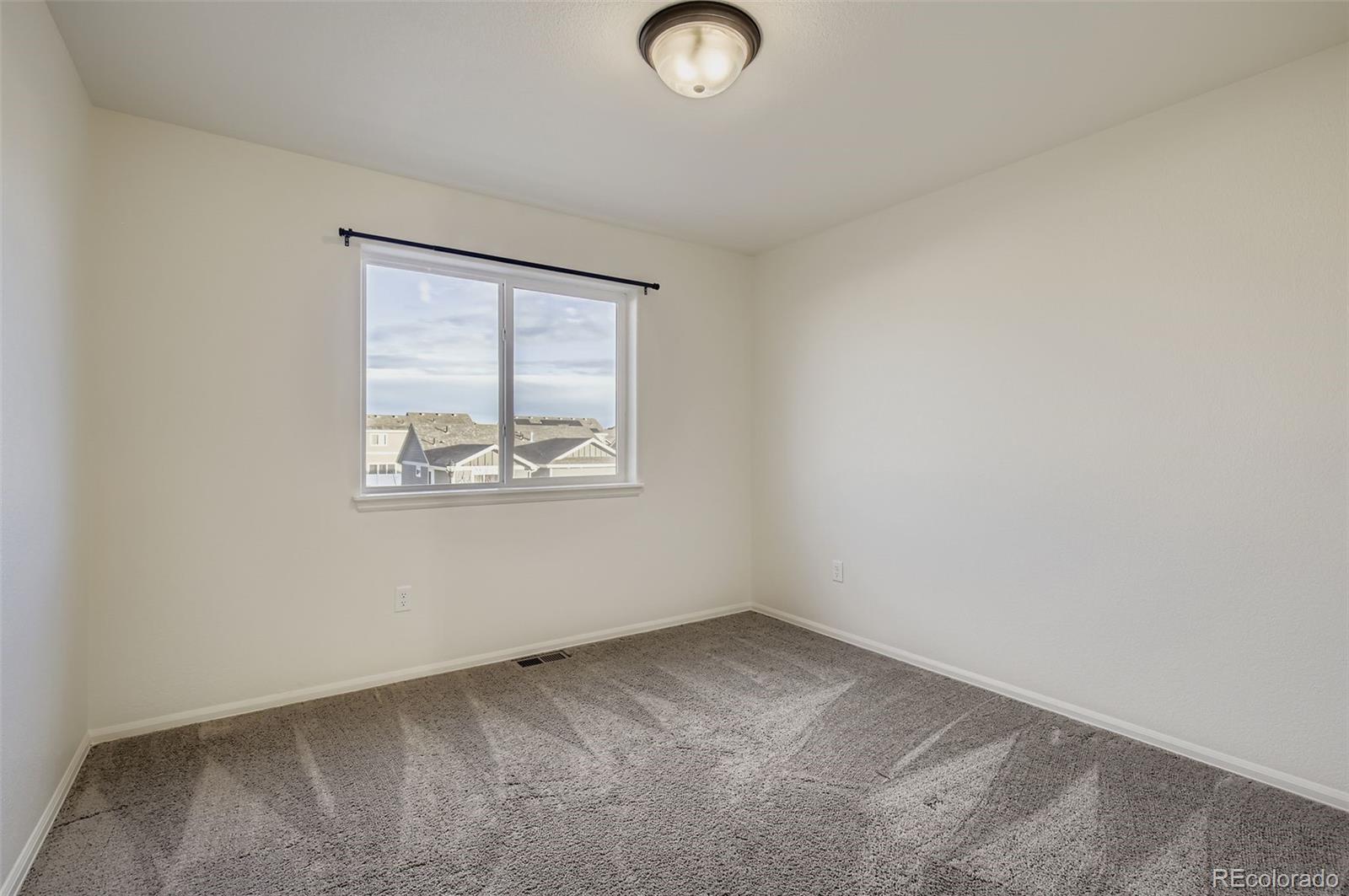 10300 19th St Road Greeley, CO 80634 - Photo 21 of 33 an empty room with windows