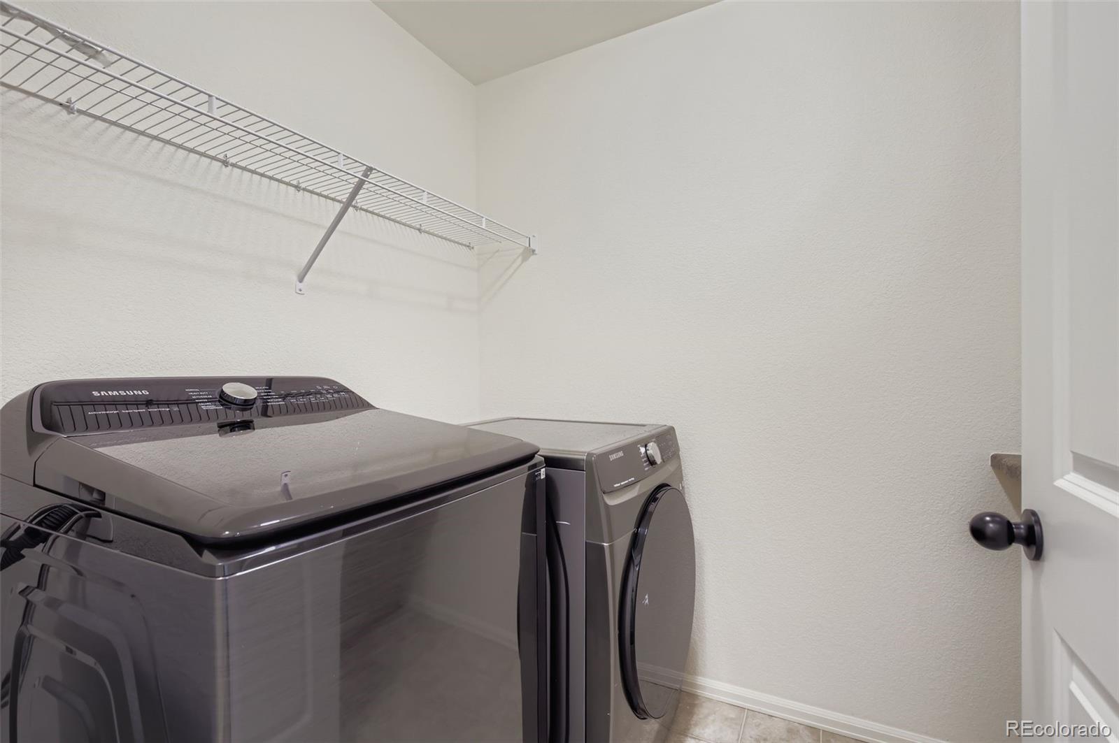 10300 19th St Road Greeley, CO 80634 - Photo 23 of 33 a utility room with dryer and washer