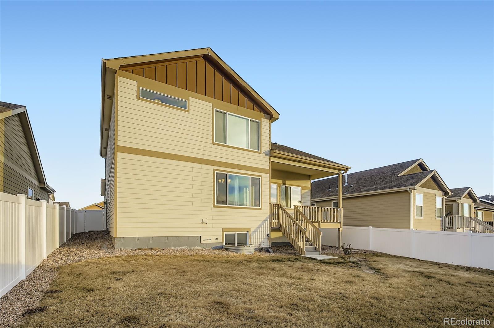 10300 19th St Road Greeley, CO 80634 - Photo 29 of 33 a front view of a house with a yard