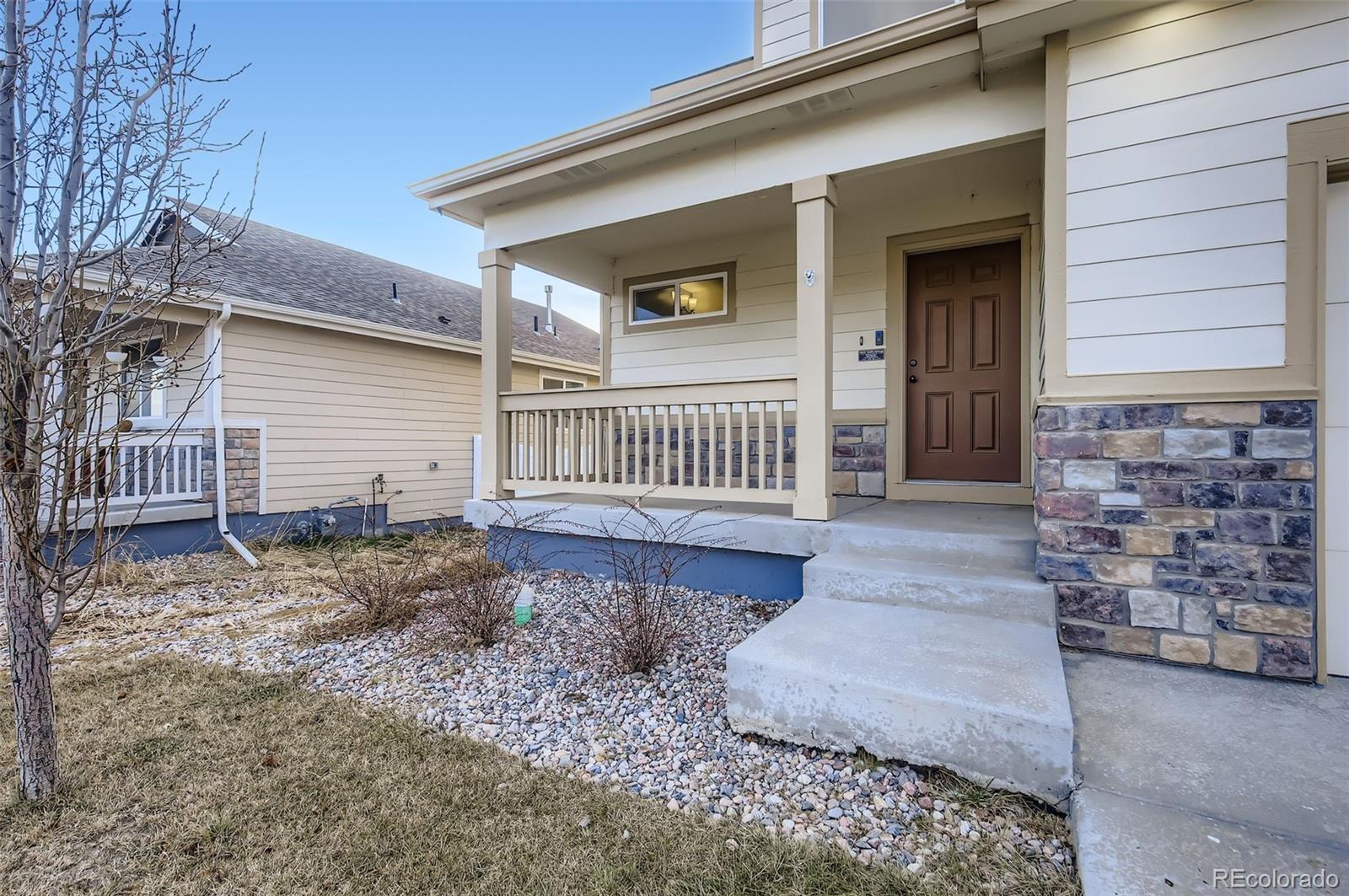 10300 19th St Road Greeley, CO 80634 - Photo 4 of 33 a front view of a house with a yard