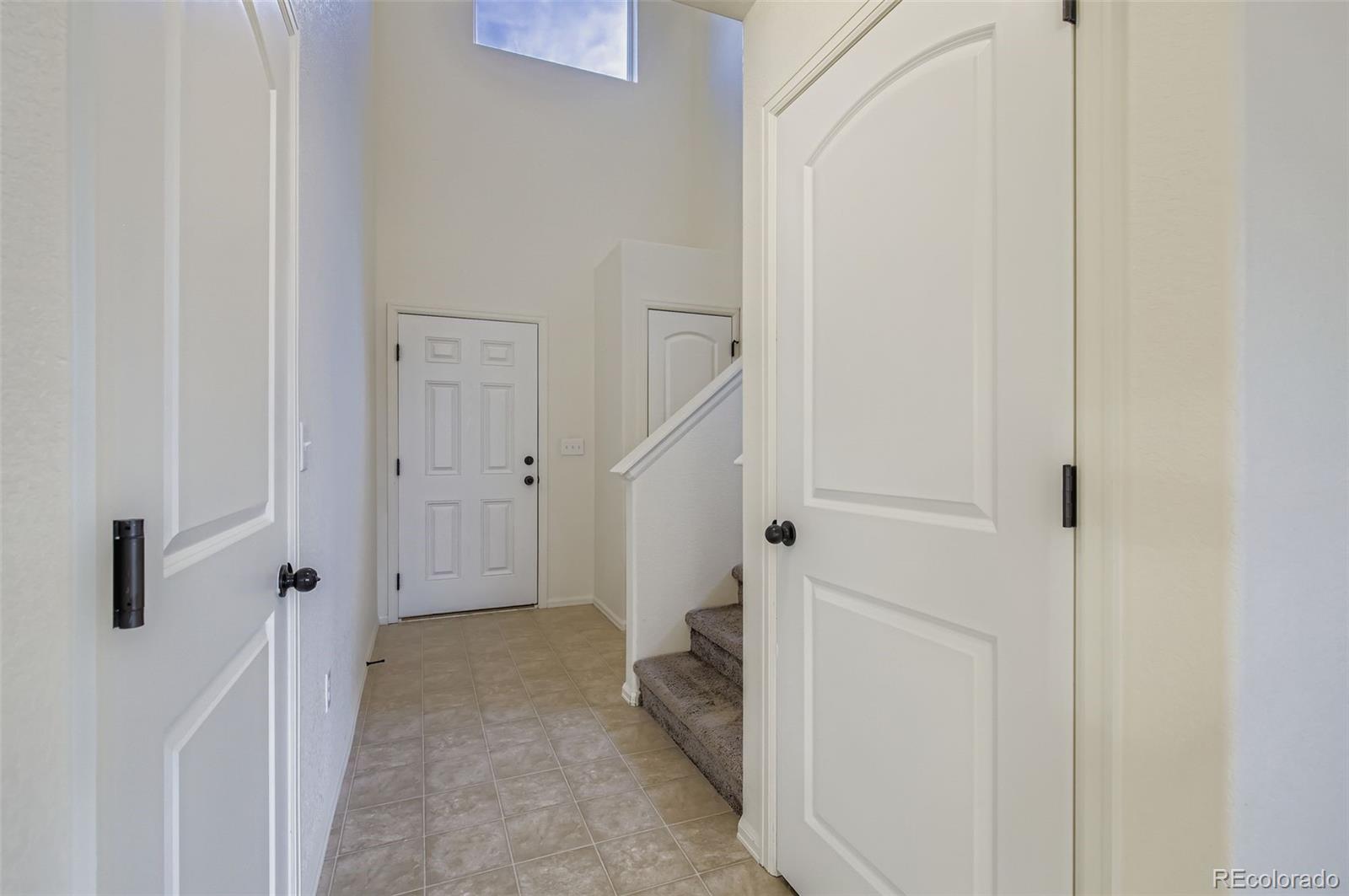 10300 19th St Road Greeley, CO 80634 - Photo 6 of 33 a view of a hallway with white walls