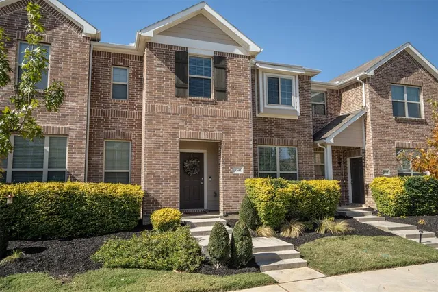 a front view of a house with yard